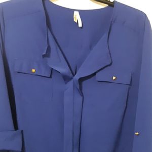 Royal blue top with rose gold decorative buttons.